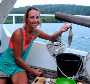 woman-with-octopus young woman Nike with an octopus on a sailboat